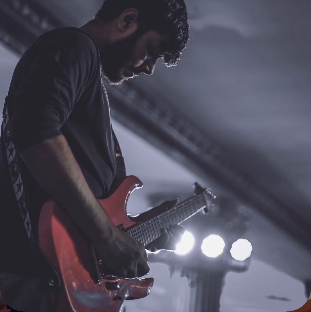 Arya Sen performing under stage lights